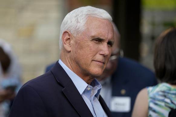 Former Vice President Mike Pence talks with local residents during a meet and greet, Tuesday, May 23, 2023, in Des Moines, Iowa. (AP Photo/Charlie Neibergall)
