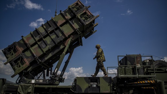 epa09937880 A German soldier walks during presentation of how it works at the launching station of NATO's Patriot missile air defense system operated by German army unit Flugabwehrraketengruppe 2 ...