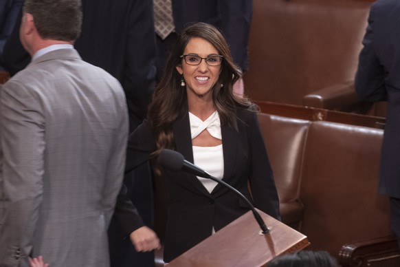 epa10389374 Colorado Republican Representative Lauren Boebert walks into the House chamber the day after House Republican leader Kevin McCarthy failed to garner enough votes to become the next Speaker of…