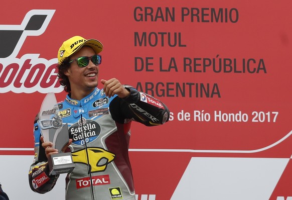 epa05900044 Italian rider Franco Morbidelli of Kalex celebrates his victory at the podium after the Moto 2 Category race at the Grand Prix of Argentina MotoGP, in the Termas de Rio Hondo, Santiago del ...