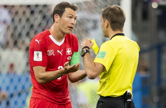 Switzerland&#039;s defender Stephan Lichtsteiner, reacts as he receives a yellow card from the referee, during the FIFA World Cup 2018 group E preliminary round soccer match between Switzerland and Co ...