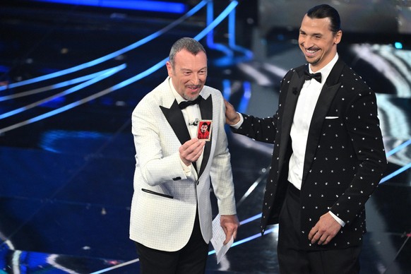 epa11132355 Sanremo Festival host and artistic director Amadeus (left) on stage with former Swedish footballer Zlatan Ibrahimovic (right) at the Ariston Theater during the 74th Sanremo Italian Song Festival...