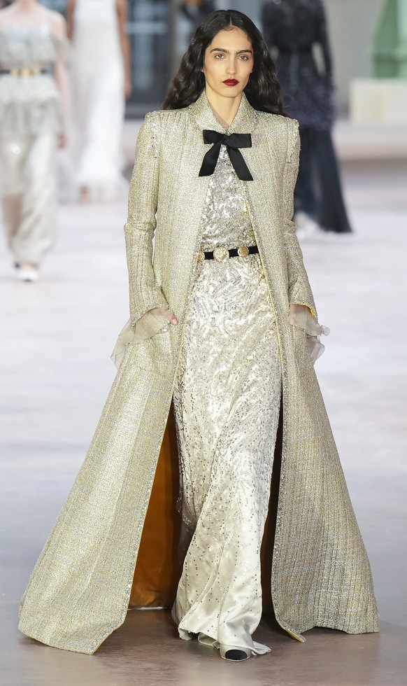Models wear creations as part of the Chanel Haute Couture Spring Summer 2025 collection, that was presented in Paris, Tuesday, Jan. 28, 2025. (AP Photo/Lewis Joly).