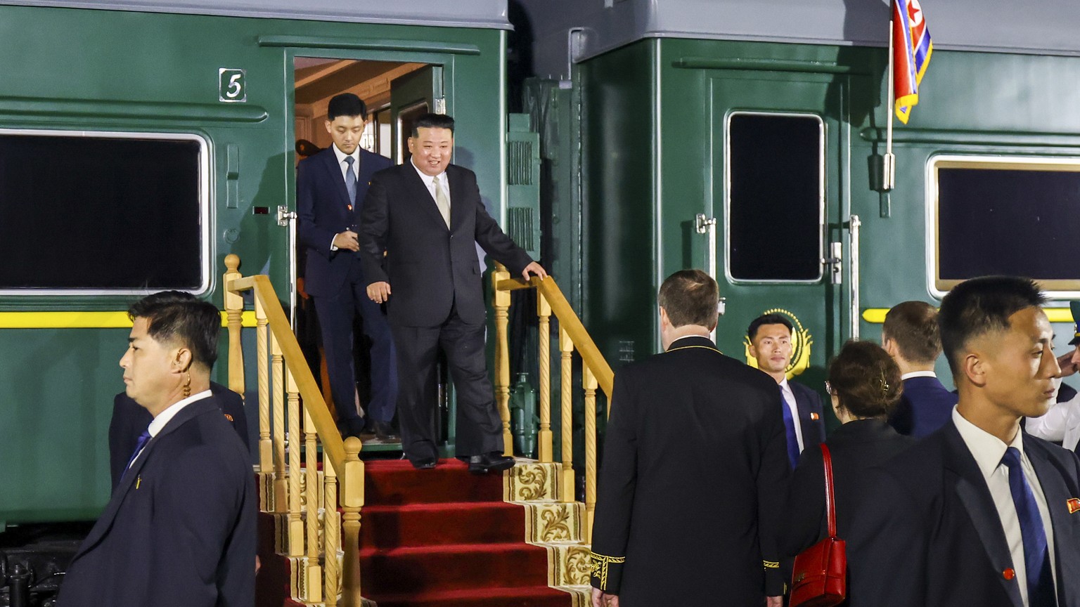 FILE - In this photo taken and provided by the Press Office of the Primorsky Krai Region Administration, North Korea&#039;s leader Kim Jong Un, center, steps down from his train after crossing the bor ...