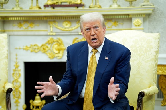 epa12253668 U.S. President Donald Trump answers reporters questions during his meeting with the Philippine president in the Oval Office at the White House in Washington, DC., USA, 22 July 2025. EPA/YU ...