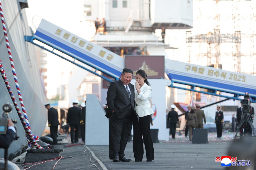epaselect epa12055579 A photo released by the official North Korean Central News Agency (KCNA) on 26 April 2025 shows North Korean Leader Kim Jong Un and daughter Kim Ju Ae attending the launching cer ...