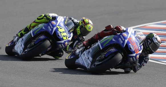 Italy's Valentino Rossi, left, rides his Yamaha behind Spain's Jorge Lorenzo with Yamaha during the MotoGP race of Argentina's Motorcycle Grand Prix at the Termas de Rio Hondo circuit in Argentina, Sunday, April 19, 2015. (AP Photo/Natacha Pisarenko)