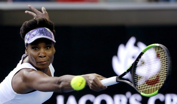 United States&#039; Venus Williams eyes the ball for a return to China&#039;s Duan Yingying during their third round match at the Australian Open tennis championships in Melbourne, Australia, Friday,  ...