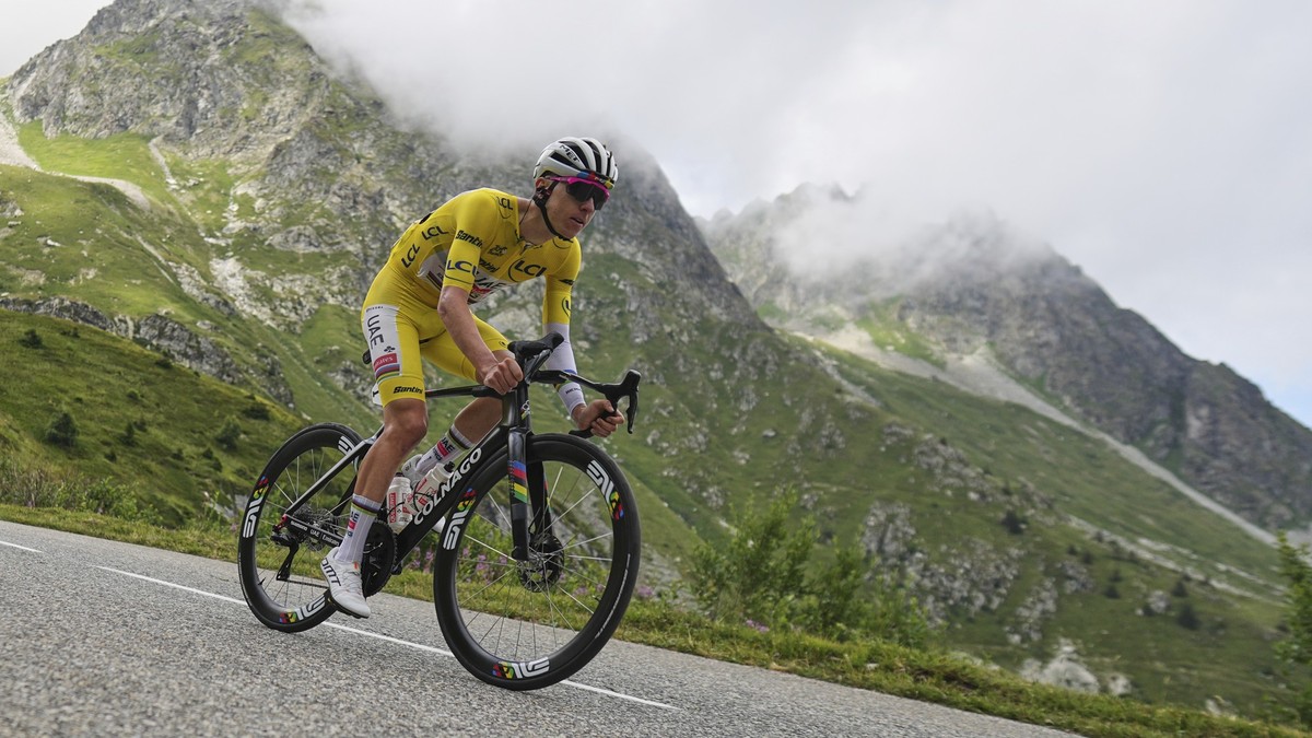 Slovenia's Tadej Pogacar, wearing the overall leader's yellow jersey, speeds down Col de la Madeleine during the eighteenth stage of the Tour de France cycling race over 171.5 kilometers (10 ...