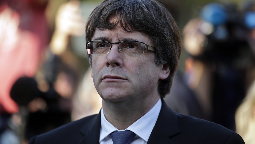 Catalan regional President Carles Puigdemont attends a ceremony commemorating the 77th anniversary of the death of Catalan leader Lluis Companys at the Montjuic Cemetery in Barcelona, Spain, Sunday, O ...