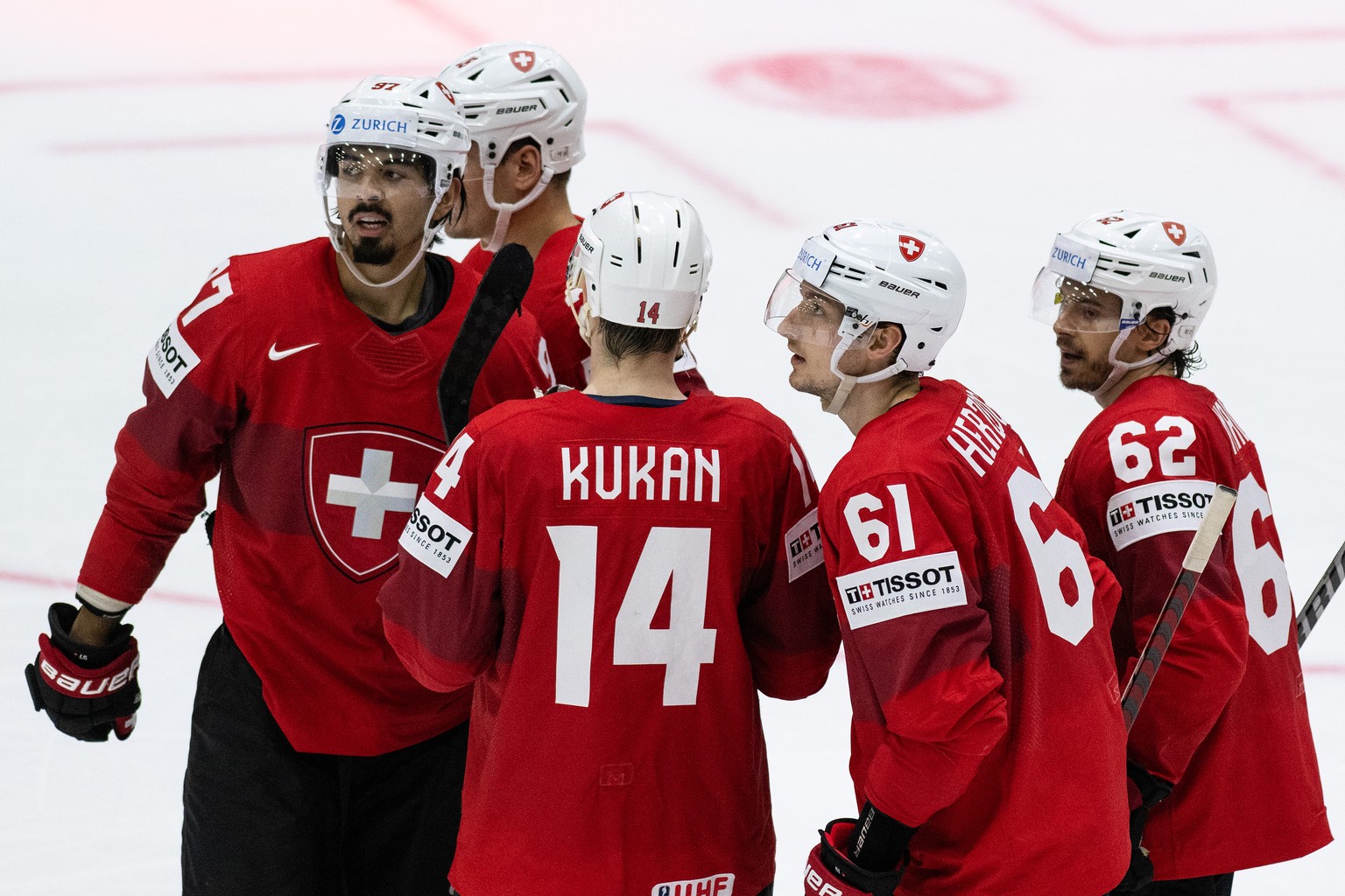 Switzerland&#039;s Jonas Siegenthaler, Dean Kukan, Fabrice Herzog and Denis Malgin, from left, celebrate their goal to 5-3 during the Ice Hockey World Championship group A preliminary round match betw ...