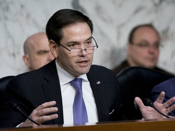 FILE - In this March 21, 2018 file photo, Sen. Marco Rubio, R-Fla., left, accompanied by Sen. Susan Collins, R-Maine,