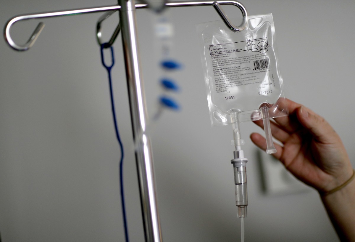 FILE- In this Feb. 9, 2018, file photo, a nurse hooks up an IV to a flu patient at Upson Regional Medical Center in Thomaston, Ga. Health insurance costs have climbed so high, thereÄôs insurance for  ...