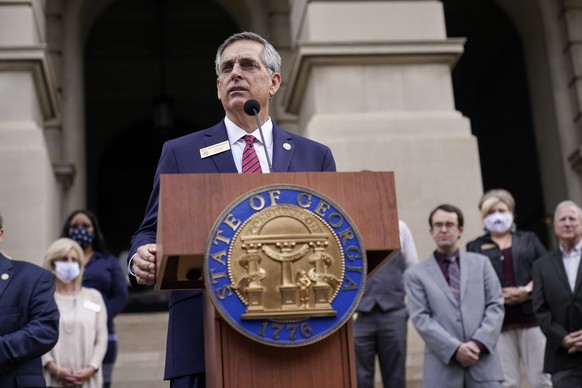 FILE - In this Wednesday, Nov. 11, 2020, file photo, Georgia Secretary of State Brad Raffensperger speaks during a news conference in Atlanta. Raffensperger is under attack from President Donald Trump ...