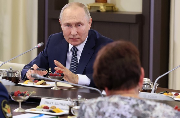 epa10327439 Russian President Vladimir Putin meets with mothers of Russia's servicemen participating in the special military operation in Ukraine, at the Novo-Ogaryovo state residence, outside Moscow, ...