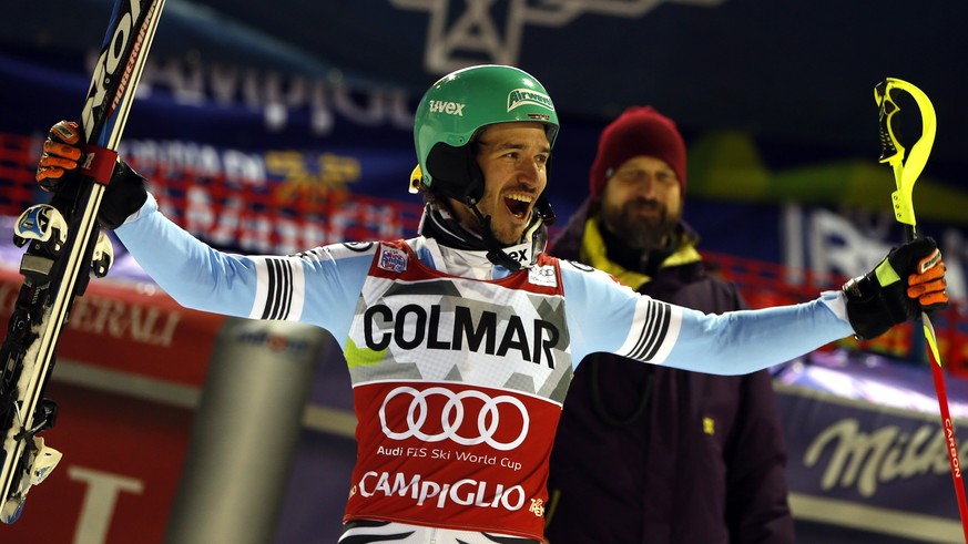 Felix Neureuther, of Germany, celebrates at the finish area after taking the first place of an alpine ski, men's World Cup slalom in Madonna di Campiglio, Italy, Monday, Dec. 22, 2014. Felix Neur ...