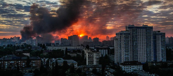 Smoke raises above the city in sunrise following an intensive Russian air attack in Kyiv, Ukraine, Sunday, May 24, 2026. (AP Photo/Zoya Shu)
Russia Ukraine War