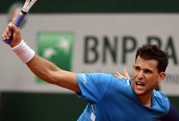 epa07622631 Dominic Thiem of Austria plays Gael Monfils of France during their menâs round of 16 match during the French Open tennis tournament at Roland Garros in Paris, France, 03 June 2019. EPA/C ...