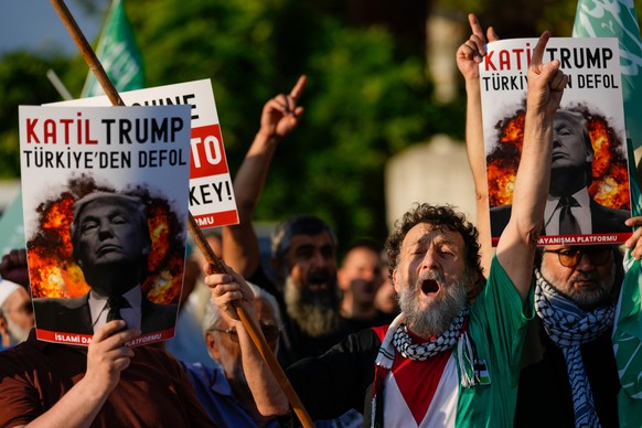 Protesters hold posters with the image of U.S. President Donald Trump during a demonstration against the upcoming NATO summit in Istanbul, Turkey, Saturday, July 4, 2026. Posters read in Turkish: &quo ...