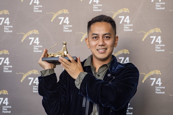 Film producer Muhammad Zaidy from Indonesia of the Film: Vengeance is Mine - All Others Pay Cash, is posing with the Pardo d&#039;Oro (the Golden Leopard) during a photocall at the 74th Locarno Intern ...