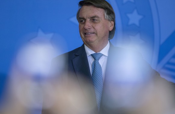 epa09927300 The President of Brazil, Jair Bolsonaro, participates in the ceremony of New Deliveries of the Income and Opportunity Program at the Palacio do Planalto, in Brasilia, Brazil, 04 May 2022.  ...