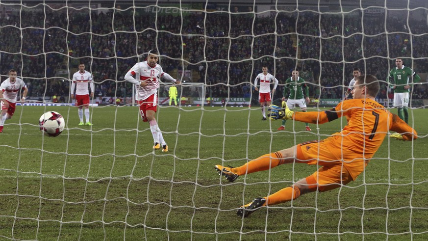 Switzerland&#039;s Ricardo Rodriguez scores the opening goal from the penalty spot during the World Cup qualifying play-off first leg soccer match between Northern Ireland and Switzerland at Windsor P ...