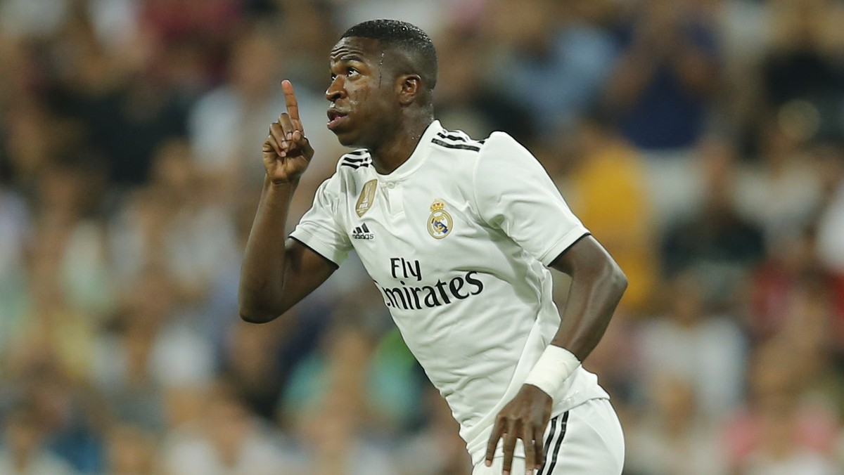 Real Madrid's Vinicius Junior gestures as he enters the pitch during a Spanish La Liga soccer match between Real Madrid and Atletico Madrid at the Santiago Bernabeu stadium in Madrid, Spain, Satu ...