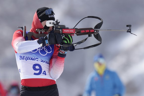 Joscha Burkhalter of Switzerland shoots during zeroing in the men&#039;s 4x7.5-kilometer relay at the 2022 Winter Olympics, Tuesday, Feb. 15, 2022, in Zhangjiakou, China. (AP Photo/Kirsty Wigglesworth ...