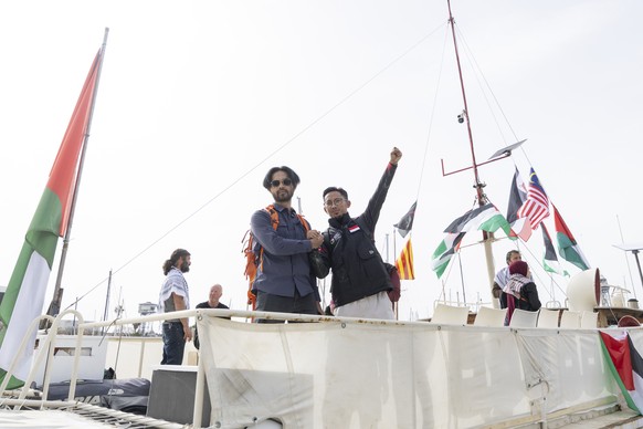 epa12882269 Several activists take part in preparations for the departure of the Global Sumud Flotilla at the port of Barcelona, northeastern Spain, 11 April 2026. A total of 70 vessels carrying some  ...