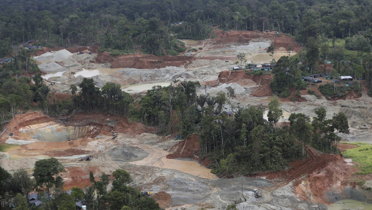 FILE - An illegal gold mining operation that contributed to deforestation is visible in Magui Payan, Colombia, April 20, 2021. The mine was among targets for destruction by National Police and soldier ...