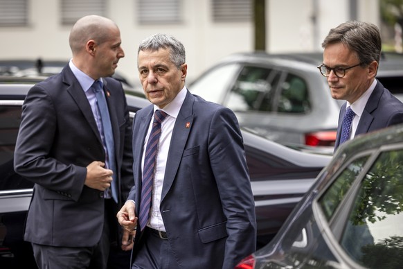 epa11431938 Swiss Federal Councillor Ignazio Cassis arrives to a news coference in Roveredo in the Misox valley, southern Switzerland, 23 June 2024. Massive thunderstorms and rainfall led to a floodin ...