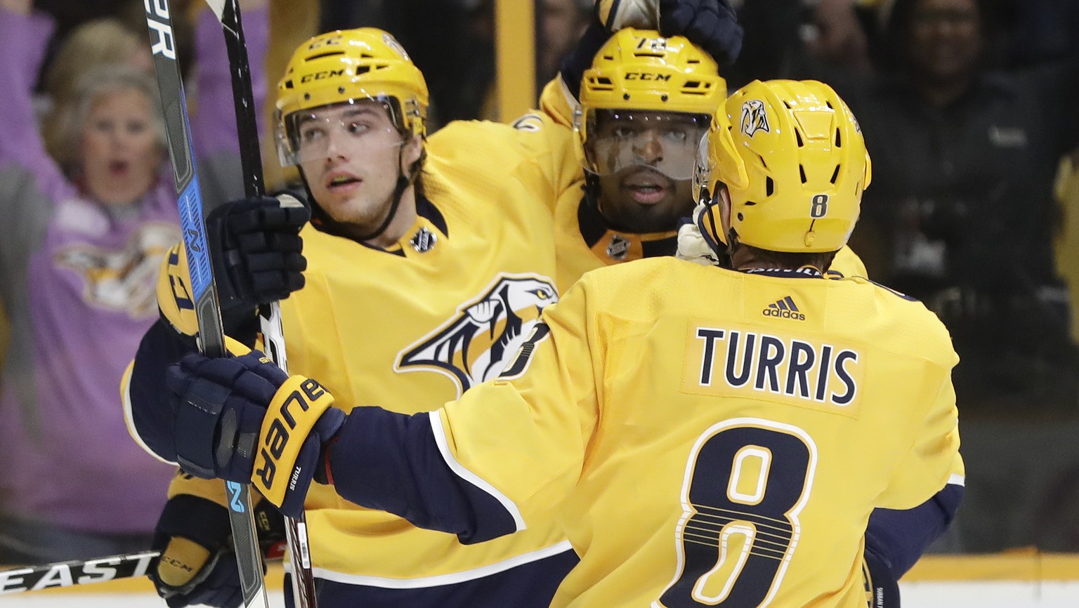 Nashville Predators left wing Kevin Fiala (22), of Switzerland, celebrates with P.K. Subban (76) and Kyle Turris (8) after Fiala scored a goal against the Boston Bruins in the second period of an NHL  ...