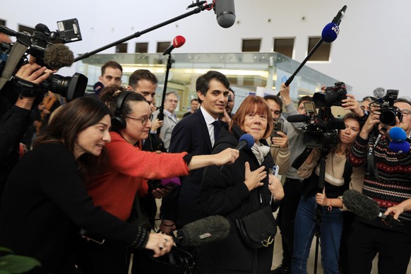 epa11731195 Gisele Pelicot (R), escorted by her lawyers Stephane Babonneau (C) and Antoine Camus (L) leaves the criminal court in Avignon, France, 20 November 2024, where her ex-husband stands trial.  ...