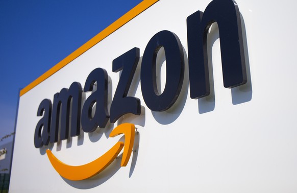 FILE - A company logo is seen at the entrance of Amazon, in Douai, northern France, on April 16, 2020.Amazon has agreed to make major changes to its business practices to settle antitrust investigatio ...