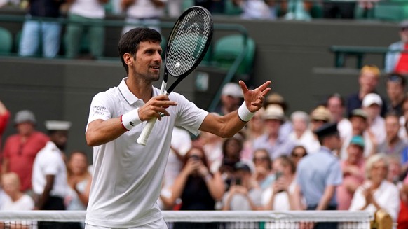 epa07697635 Novak Djokovic of Serbia celebrates winning against Hubert Hurkacz of Poland during their third round match at the Wimbledon Championships at the All England Lawn Tennis Club, in London, B ...