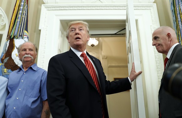 President Donald Trump departs after speaking during a meeting with survivors of the attack on USS Arizona at Pearl Harbor, in the Oval Office of the White House, Friday, July 21, 2017, in Washington. ...