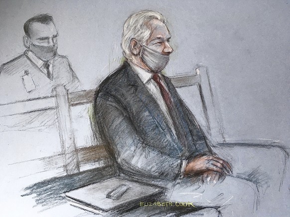 This is a court artist sketch by Elizabeth Cook of Julian Assange appearing at the Old Bailey in London for the ruling in his extradition case, in London, Monday, Jan. 4, 2021. A British judge has rej ...