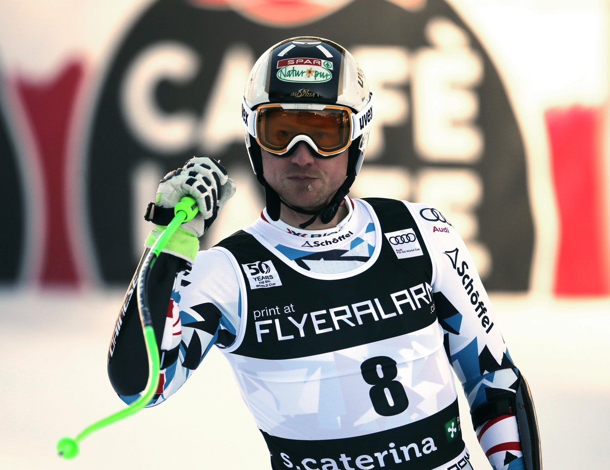 Austria's Hannes Reichelt reacts at the finish area during an alpine ski, mens' World Cup Super G, in Santa Caterina, Italy, Tuesday, Dec. 27, 2016. (AP Photo/Marco Trovati)