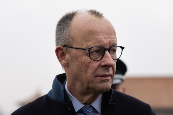 epa12777433 German Chancellor Friedrich Merz visits the Forbidden City in Beijing, China, 26 February 2026. German Chancellor Friedrich Merz is visiting China from 25 February to 26 February. EPA/JESS ...