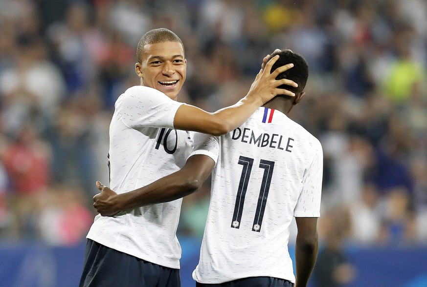 epa06779194 Kylian Mbappe of France (L) reacts with his teammate Ousmane Dembele (R) during the International Friendly soccer match between France and Italy in Nice, France, 01 June 2018. EPA/SEBASTIE ...