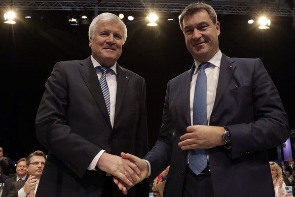 Candidate for new State Governor Markus Soeder, right, and Bavarian State Governor and Chairman of German Christian Social Union party, CSU, Horst Seehofer, pose at a party convention of the German Ch ...