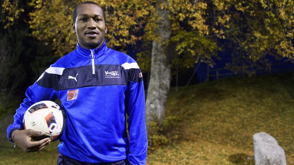 Cameroonian soccer player Eric Djemba-Djemba poses with a ball before a training session with the FC Vallorbe-Ballaigues, in Ballaigues, Switzerland, on Thursday, November 3, 2016. The former player o ...