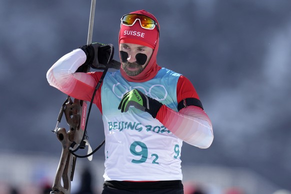 Benjamin Weger of Switzerland is seen during zeroing in the men&#039;s 4x7.5-kilometer relay at the 2022 Winter Olympics, Tuesday, Feb. 15, 2022, in Zhangjiakou, China. (AP Photo/Kirsty Wigglesworth)