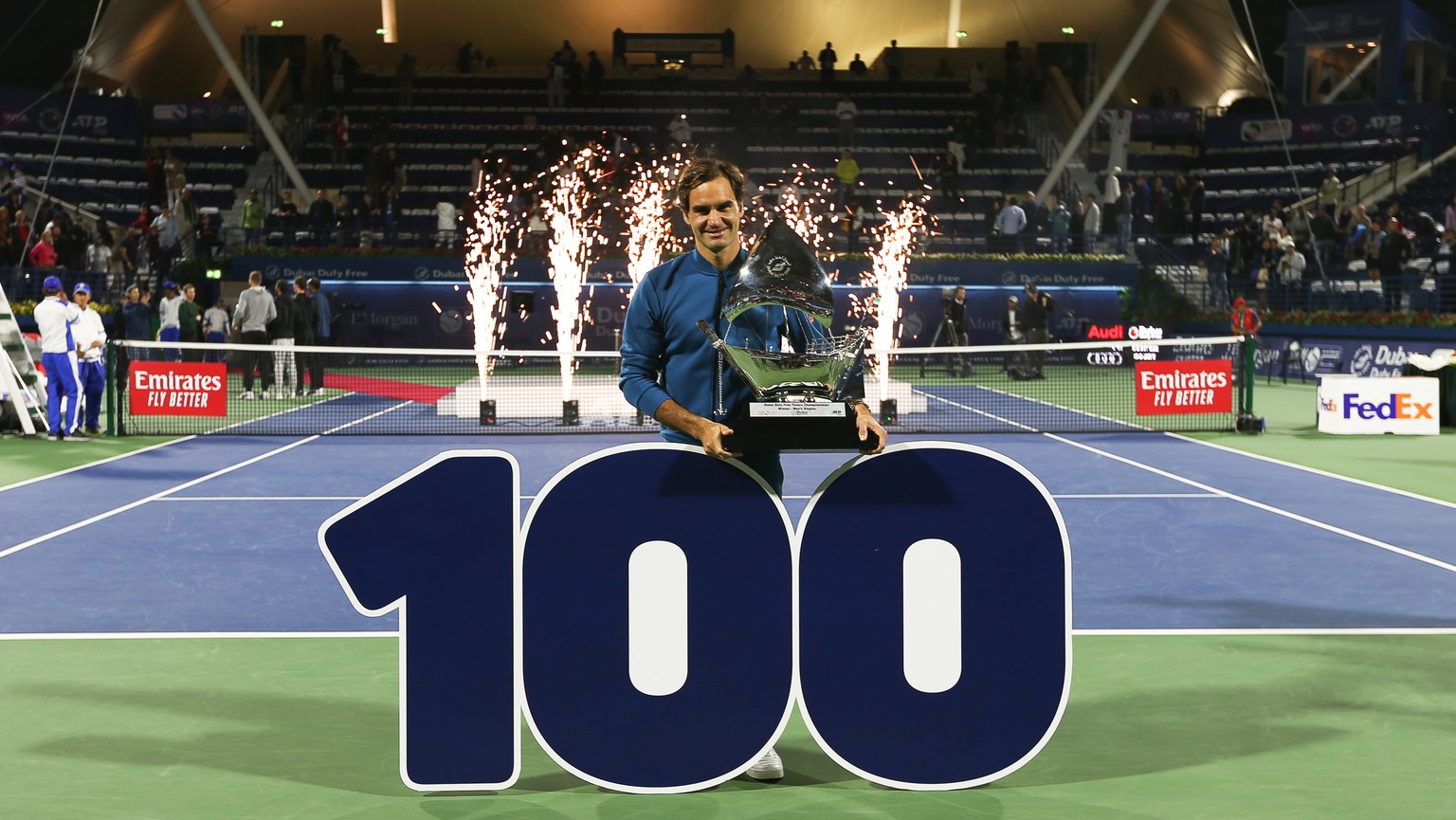 epa07408984 Roger Federer of Switzerland poses with his trophy after defeating Stefanos Tsitsipas of Greece in their final match at the Dubai Duty Free Tennis ATP Championships 2019 in Dubai, United A ...