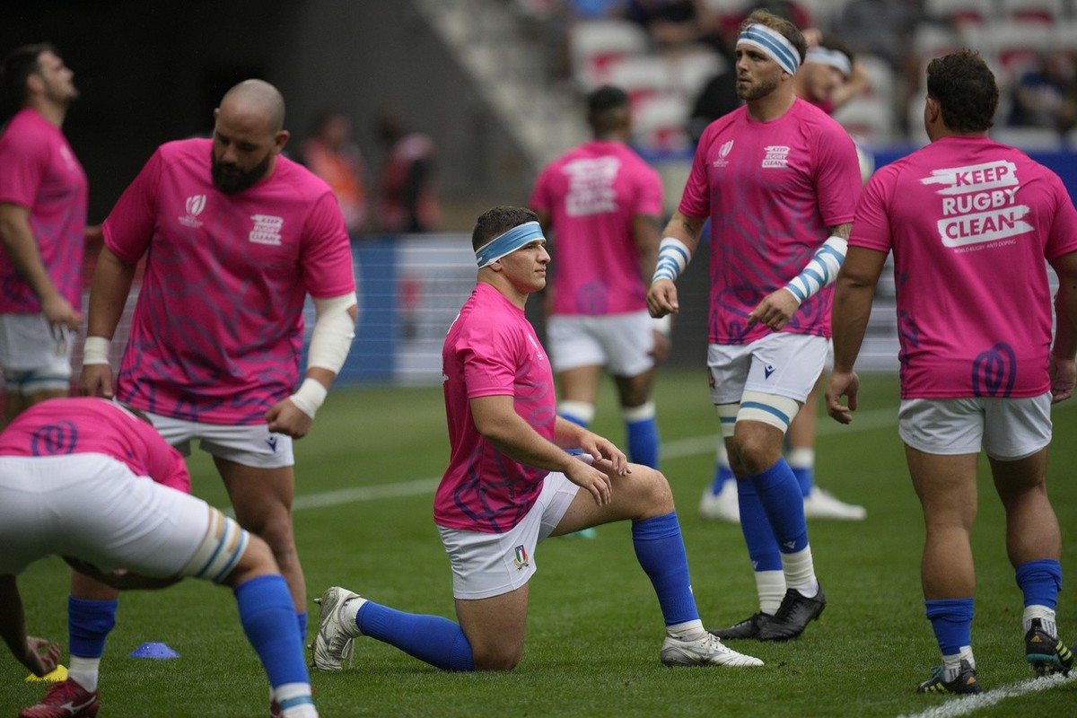 Italy's players warming up before the start for the Rugby World Cup Pool A match between Italy and Uruguay at the Stade de Nice, in Nice, Wednesday, Sept. 20, 2023. (AP Photo/Daniel Cole)