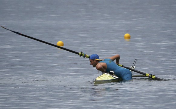 2016 Rio Olympics - Rowing - Repechage - Men&#039;s Single Sculls Repechages - Lagoa Stadium - Rio De Janeiro, Brazil - 08/08/2016. Vladislav Yakovlev (KAZ) of Kazakhstan after capsizing. REUTERS/Carl ...