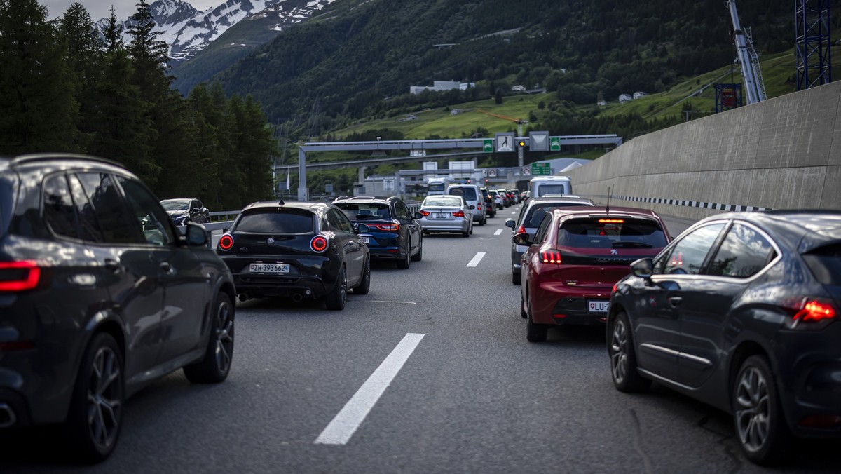 Vehicles jam in front of the Gotthard south portal in Airolo after the A13 highway on the San Bernardino route is partially destroyed and consequently closed due to massive thunderstorms in the Misox  ...