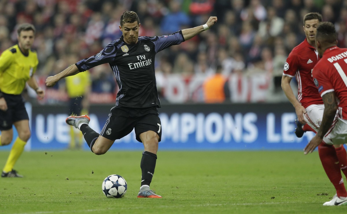 Real Madrid's Cristiano Ronaldo kicks the ball during the Champions League quarterfinal first leg soccer match between FC Bayern Munich and Real Madrid, in Munich, Germany, Wednesday, April 12, 2 ...