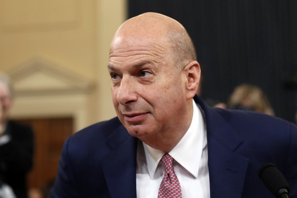 U.S. Ambassador to the European Union Gordon Sondland returns from a break as he testifies before the House Intelligence Committee on Capitol Hill in Washington, Wednesday, Nov. 20, 2019, during a pub ...