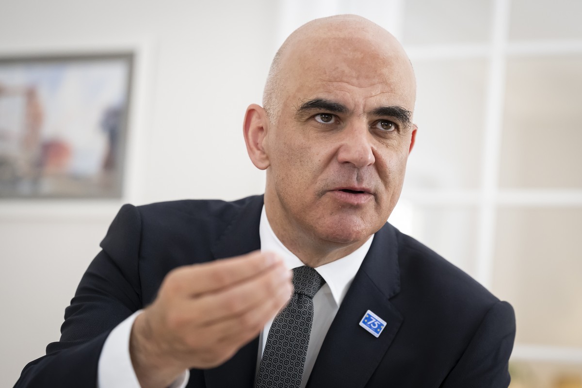New elected Secretary General of the Council of Europe Switzerland's Alain Berset, speaks with Valerie de Graffenried, Journalist for Le Temps (not pictured), after a press conference one day aft ...
